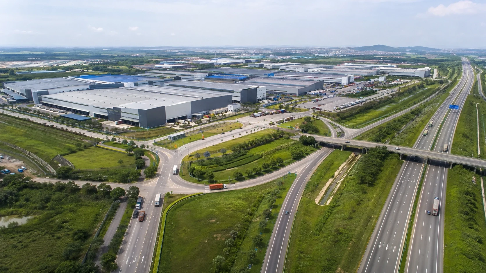 Aerial view of an industrial park with highway and logistics access