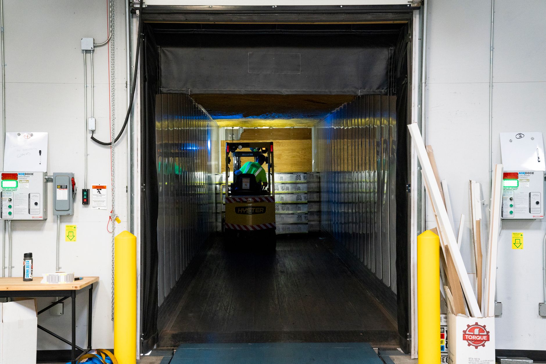 Warehouse interior with loading bay and forklift in Johor